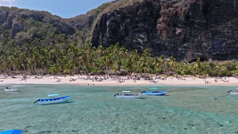 tropical paradise beach with clear blue water and empty ships, aerial establish