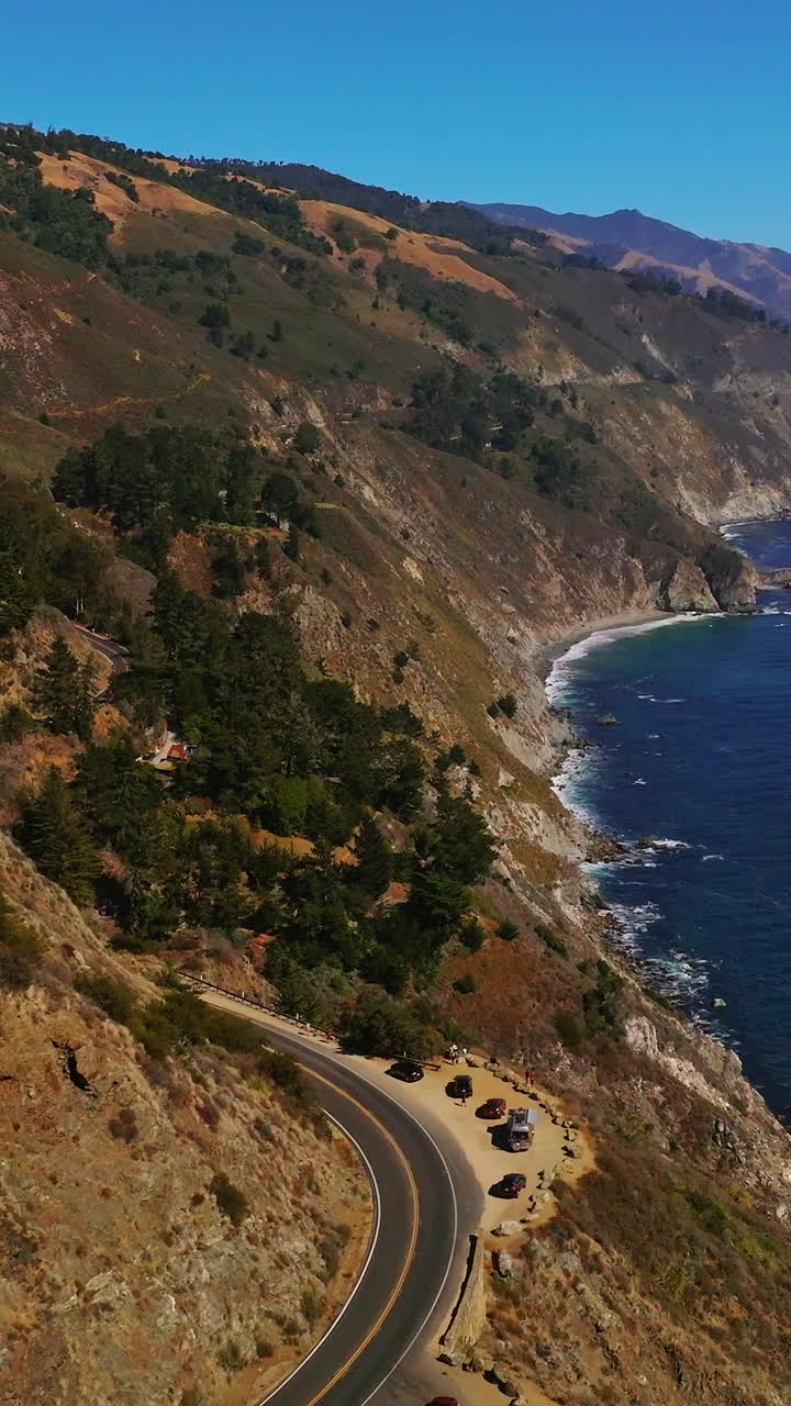 Summer cliff coastline scenery. Huge rocky shore aerial view. Vertical video