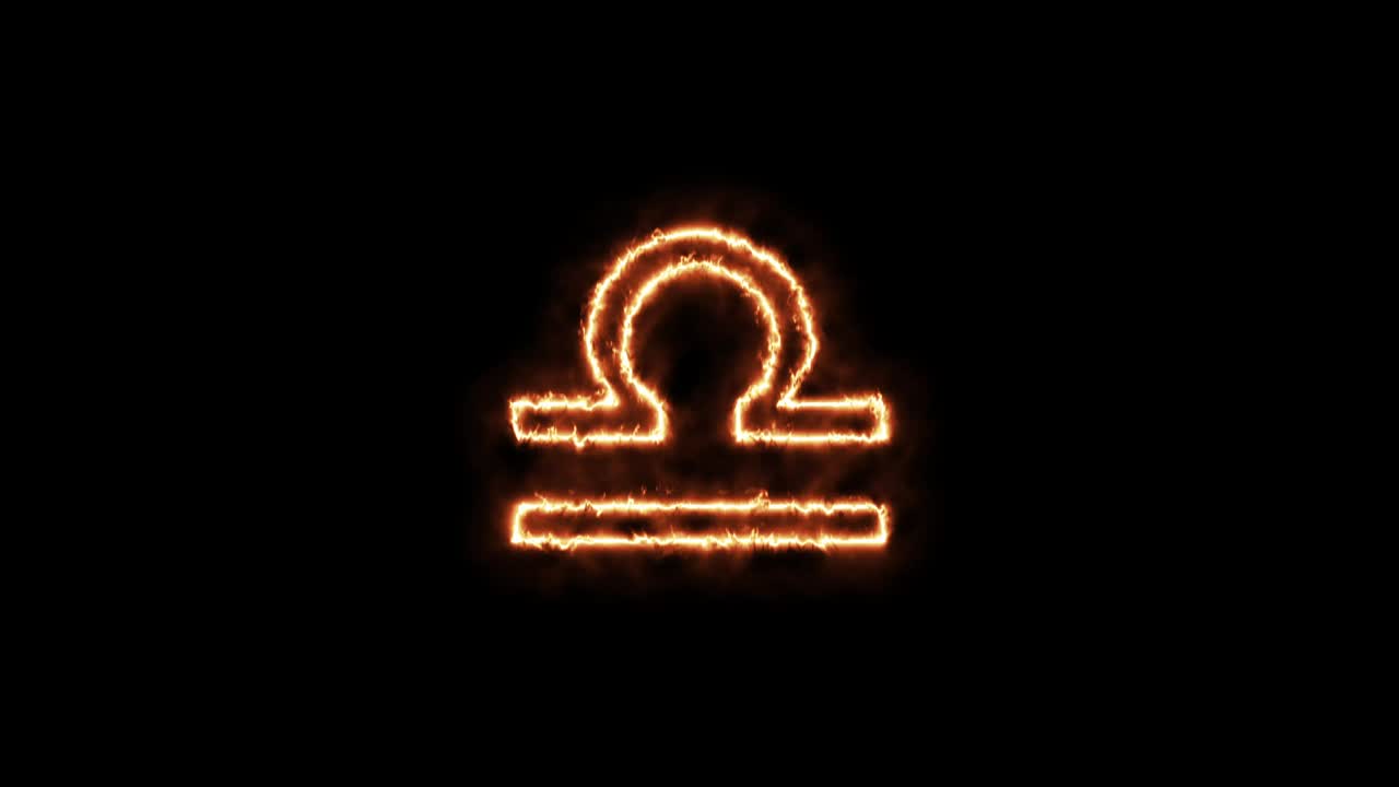 signos del zodiaco libra en el fuego. animación en un fondo negro letras 4k video está ardiendo en una llama.