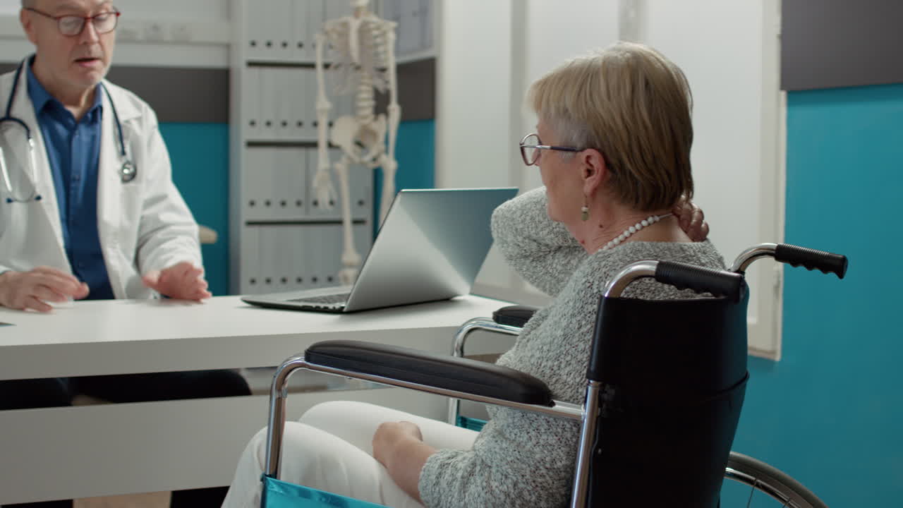 General practitioner consulting woman with chronic disability