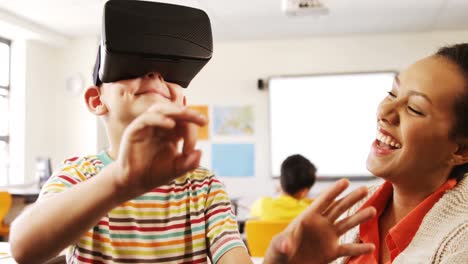 boy using virtual reality headset in classroom