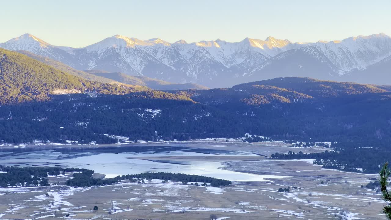 A static frame capturing Lake Matemale and the Pyrenees Mountains in France