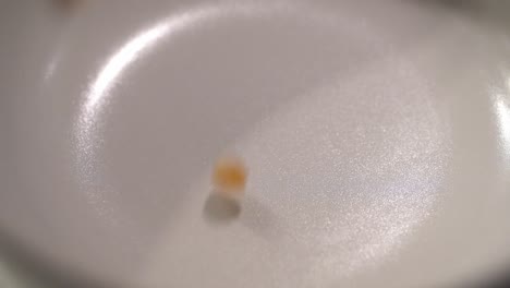 closeup footage of raw popcorn in slow motion