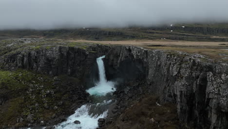 Folaldafoss-Waterfall:-A-close-up-aerial-shot-of-the-beautiful-Icelandic-waterfall-on-a-cloudy-day