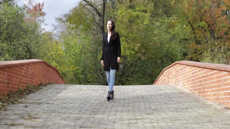 Happy-woman-walking-on-bridge