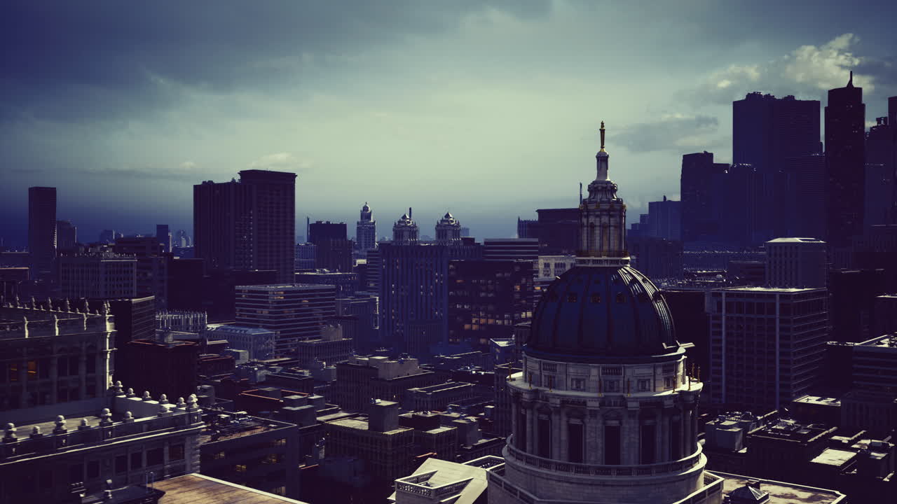 Urban skyline at dusk with dramatic lighting over city buildings