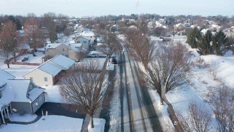 snow falling on american town