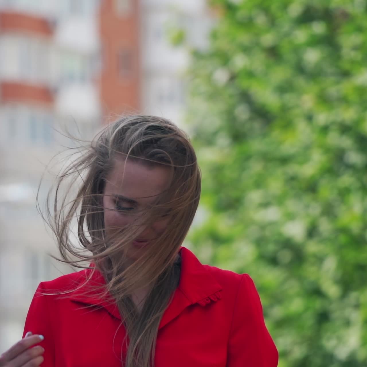 Stylish young woman posing in city streets