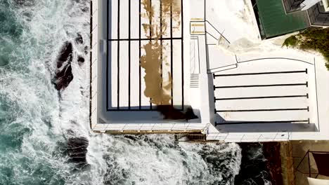 stunning aerial top-down view of bondi beach’s iconic icebergs swimming pool