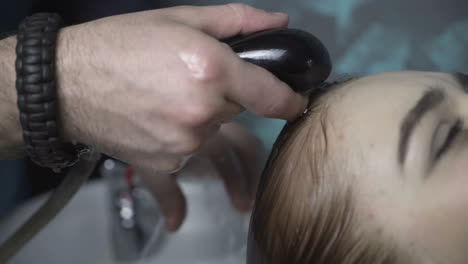 hairdresser cutting hair. stylist cutting woman hair in salon pool