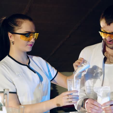 scientist conducts experiments with chemical reagents. process of creating a medicinal product. medical scientific equipment