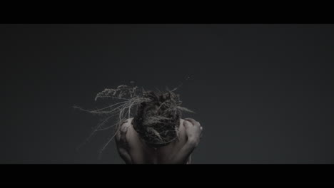 a woman dressed as mother nature rise her head