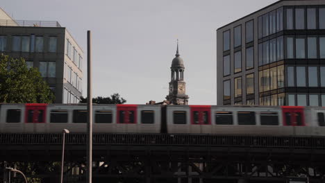 U-Bahn-Subway-train-passing-by-at-Baumwall-with-St