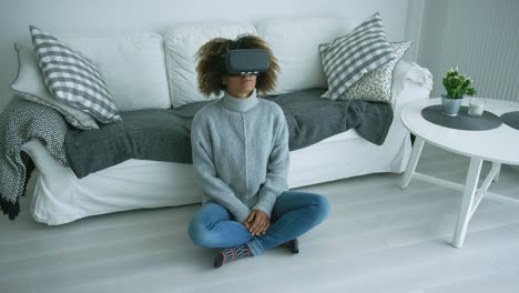 woman in vr glasses at home