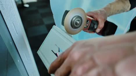 slow motion sparks burst out from powerful grinder as craftsman cuts metal beam
