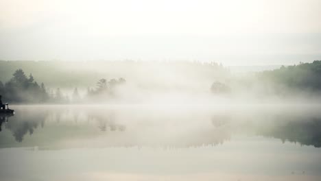 Fishermen-On-Boat-Fishing-On-Misty-Lake