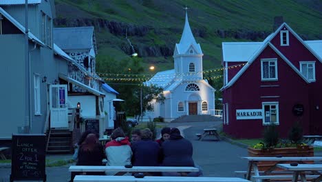 diners eat and drink at a local pub in seydisfjordur iceland 2