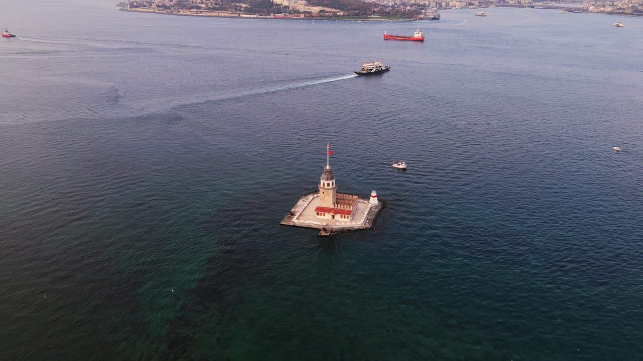 The Maiden’s Tower stands over emerald-toned waters as a ferry glides past, highlighting the beauty of the Bosphorus