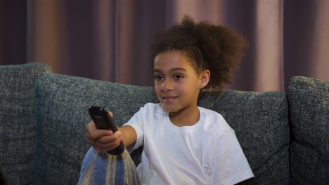 kid watching film at home