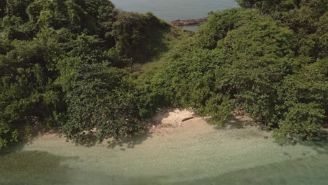 Aerial-backwards-dolly-small-beach-tropical-island-in-Thailand