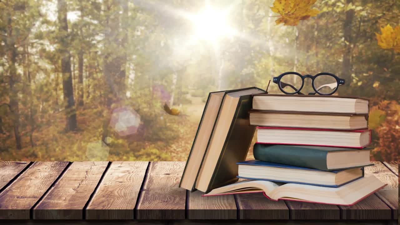 libros y espectáculos contra las hojas de otoño que caen y un fondo brillante 4k