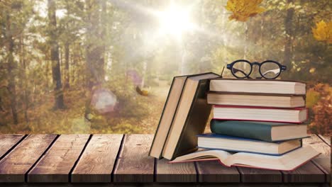 Books-and-spectacle-against-falling-autumn-leaves-and-bright-background-4k