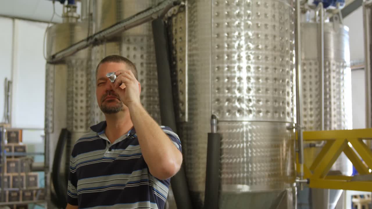 Male worker using magnifying glass 4k