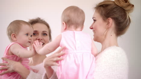 mother with baby looking mirror. sweet child playing with mirror