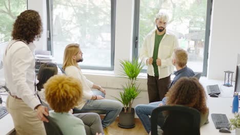 ceo of a coworking talking to colleagues in the office