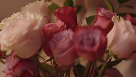 arranging a bouquet of roses