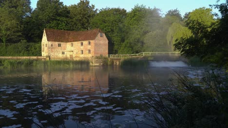 sturminster newton mill, dorset, england, early morning on the river stour, slow pan