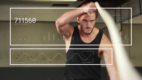 animation of data processing against caucasian fit man performing exercise with ropes at the gym