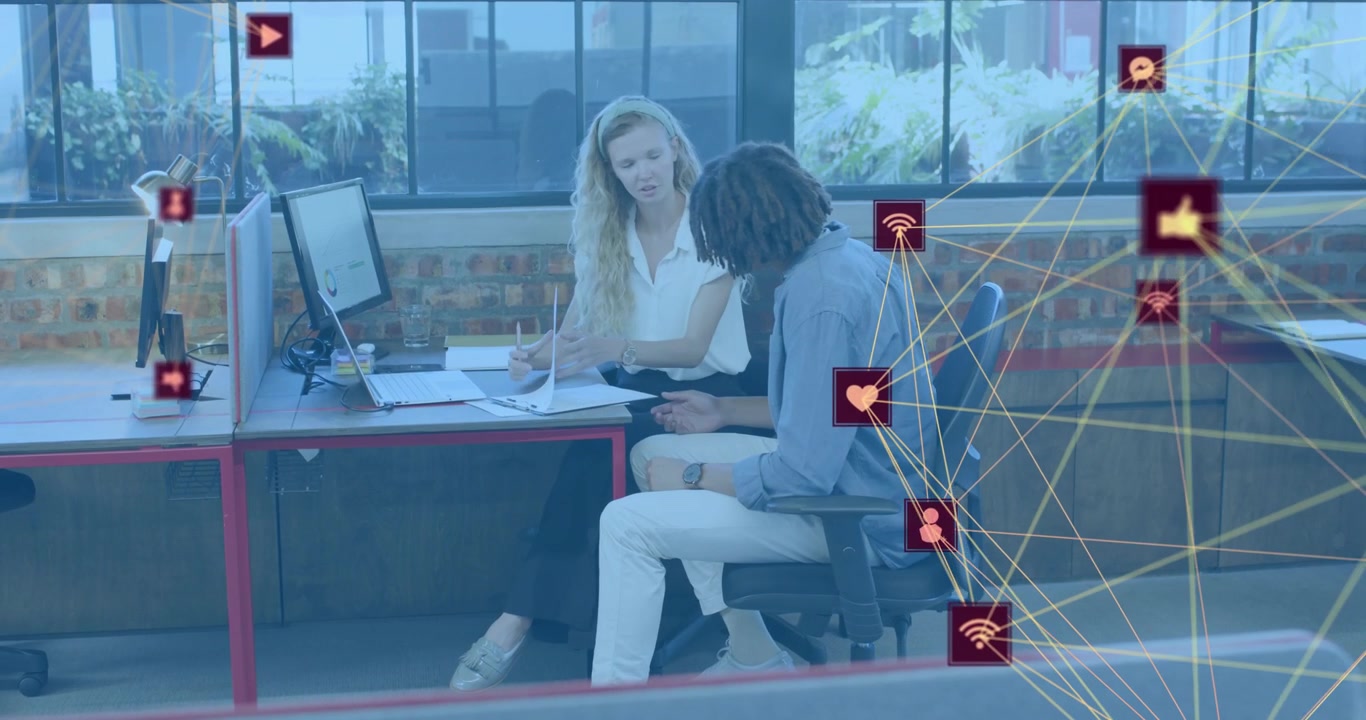 Woman pointing to papers and initiating man flipping pages in business, with icon network pulsing