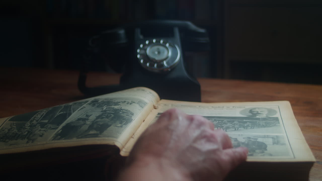 Person Take Her Glasses Onto The Open Book Then Turn Pages And Answer A Call From Vintage Telephone. - close up