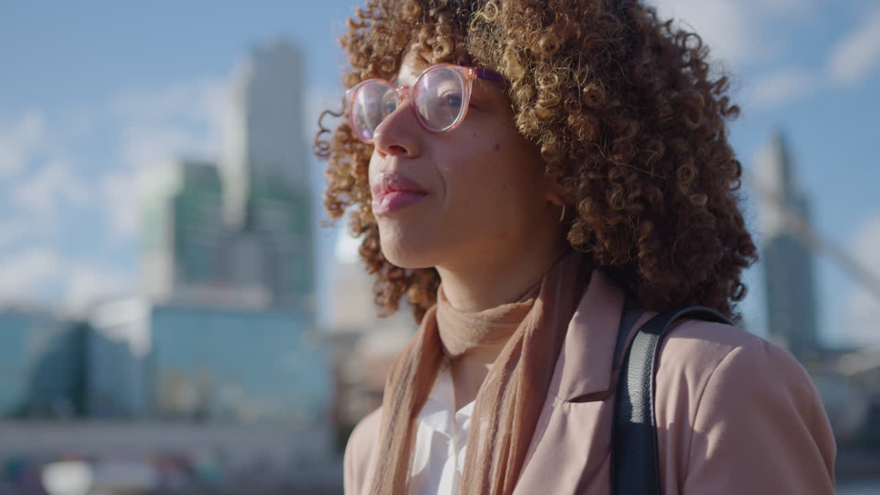 African-American Businesswoman Standing in Downtown and Using Mobile Phone