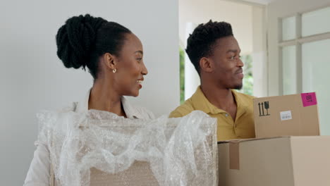 couple, box and moving into new house