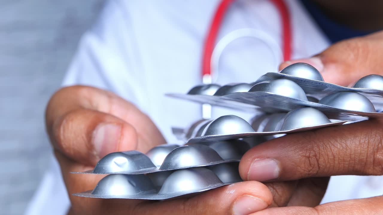 Doctor Holding Medication