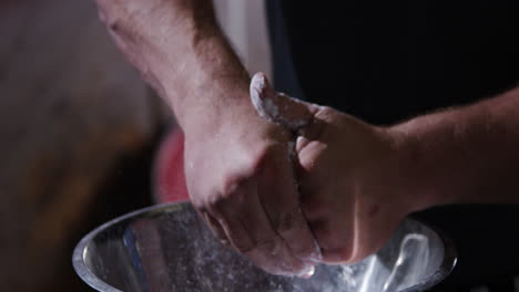 Powerlifters-rubbing-hands-with-chalk-in-gym