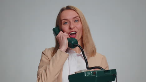 Business-woman-talking-on-wired-vintage-telephone-of-80s-says-hey-you-call-me-back-operator-helpline