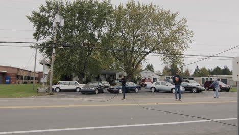 clarence, ny, usa, october 2021: cars bypass the break in the power supply cable, volunteers regulate traffic