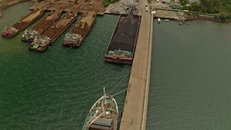 mining barges at a sumimoto site in the philippines being loaded with nickel rich ore