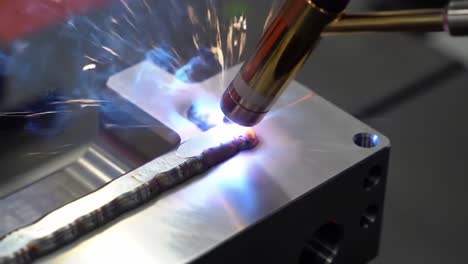 precision welding process captured in two frames, showcasing the artistry and technique of metal joining with high-temperature welding torch and bright arc sparks