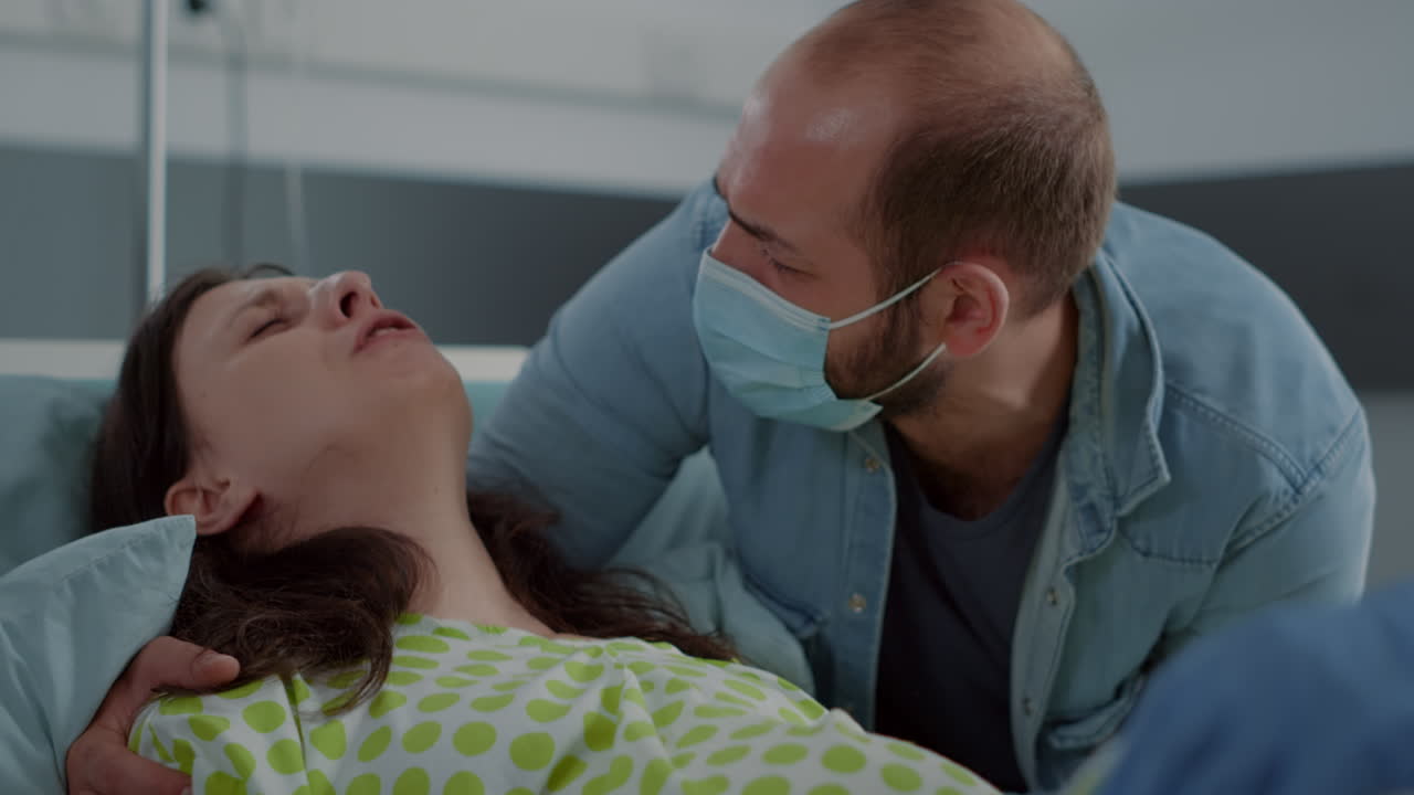 Close up of pregnant woman in pain delivering child