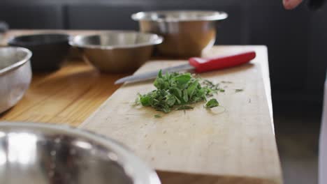 caucasian male chef cutting vegetables