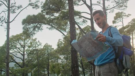 male traveler reading map