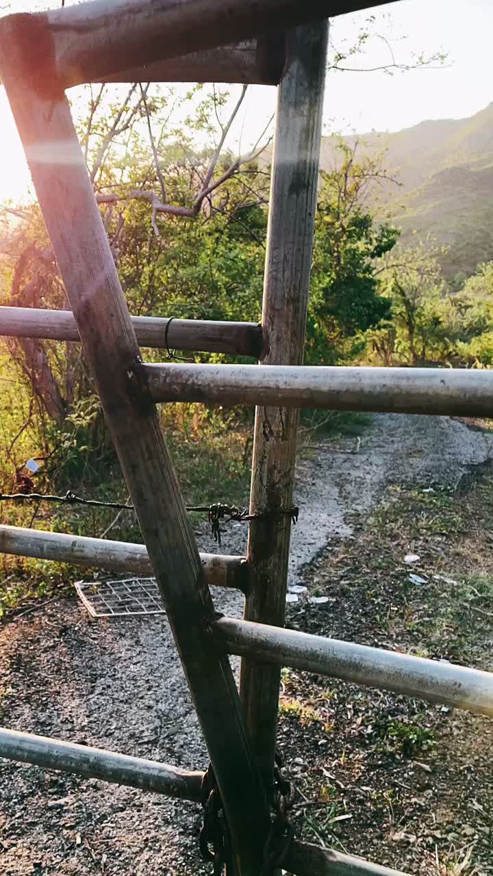 Rural Landscape with Fence and Sunset View