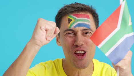 close up of a man supporting south african team