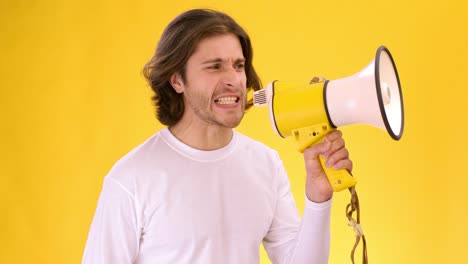 man yelling into a megaphone