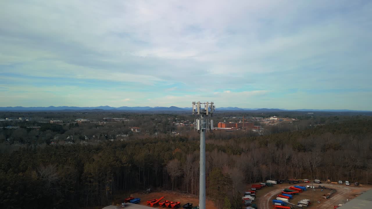 Aerial Shot Approaching Cell Phone Tower in Forest. 4K Drone