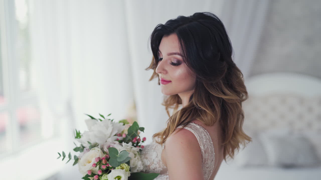 Attractive bride in fancy white wedding dress with stylish bunch of flowers. Wedding day of bride in bridal gown. Beauty woman and bouquet. Portrait of a model in a beautiful bridal dress.
